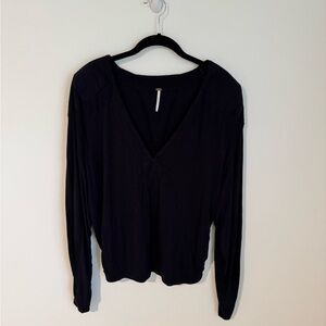 Free People black long sleeve top with shoulder pads
